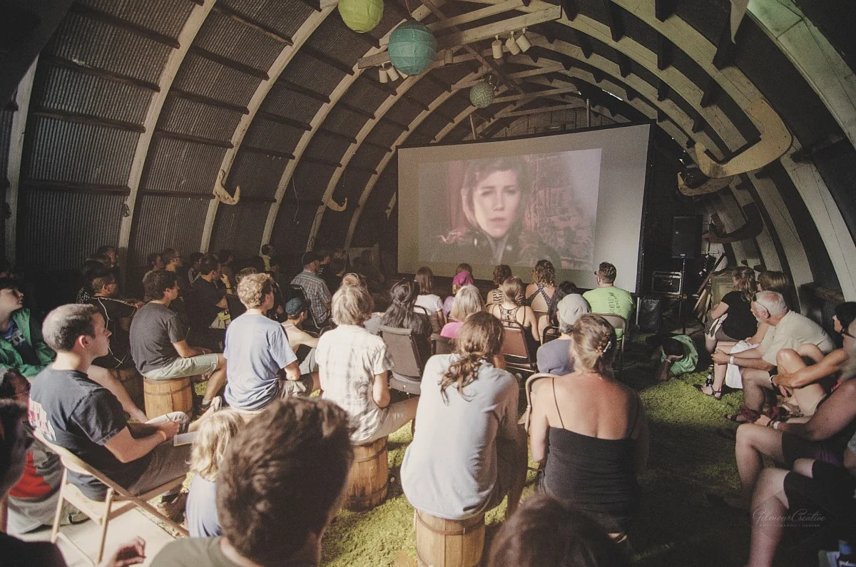 Short films and animations are shown in a small barn during the day and outside at night.