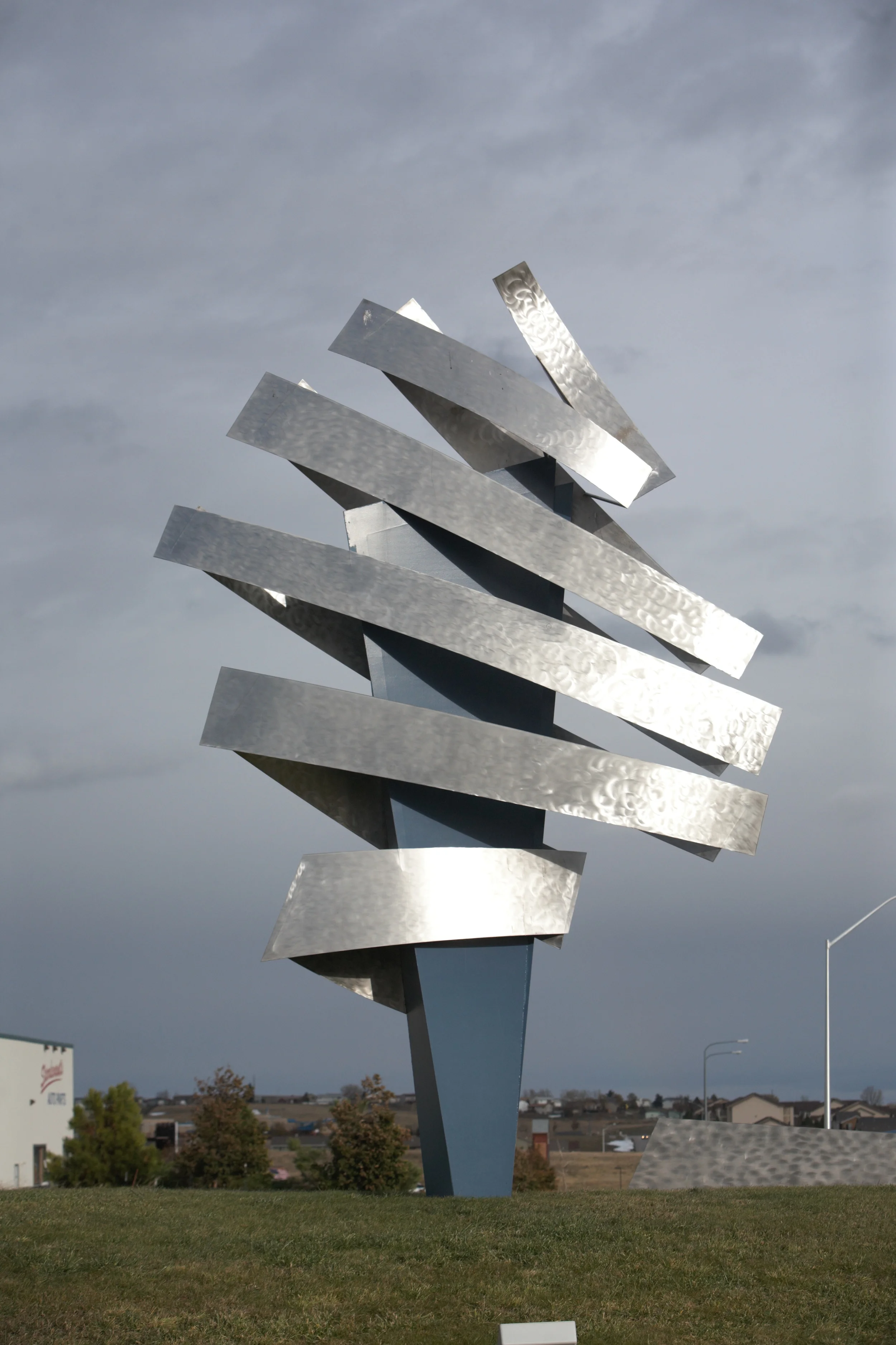 Created by internationally renowned artist Dale Lamphere, “Digital Mercury” is the symbol of Fenske Media business model. ‘Mercury’, the messenger of the gods, could never deliver at the speed that business communications travel today. The blue center spike represents the physical product of direct mail and print and is surrounded by silver bands reflecting the energy of the digital world we work and live in.