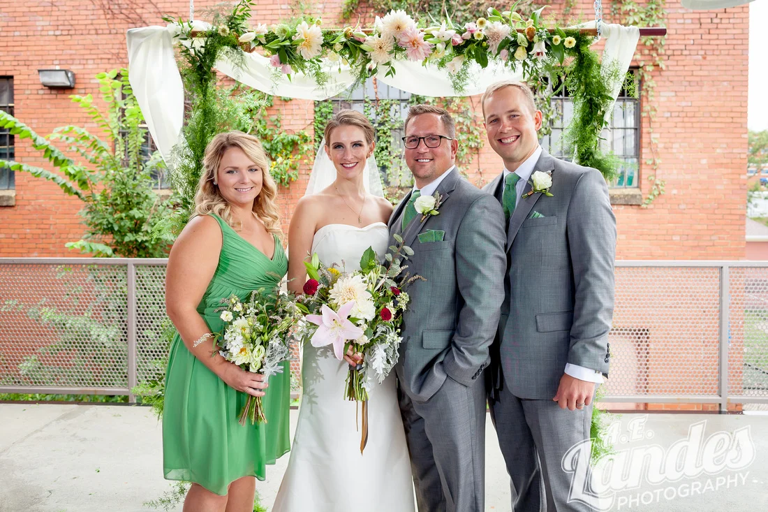 Shelby bouquets boutonnieres and arch.jpeg