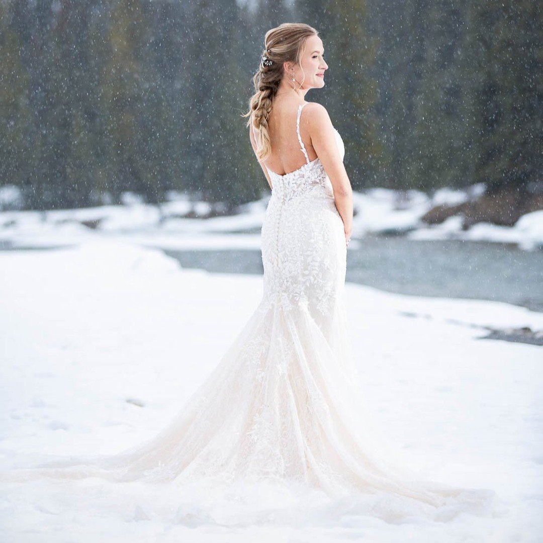 We adore this photo of Rianne braving the cold so we could photographer her in this stunning snowy scene on her wedding day. Because what you don't see here is us being chilly wusses photographing in snow pants.