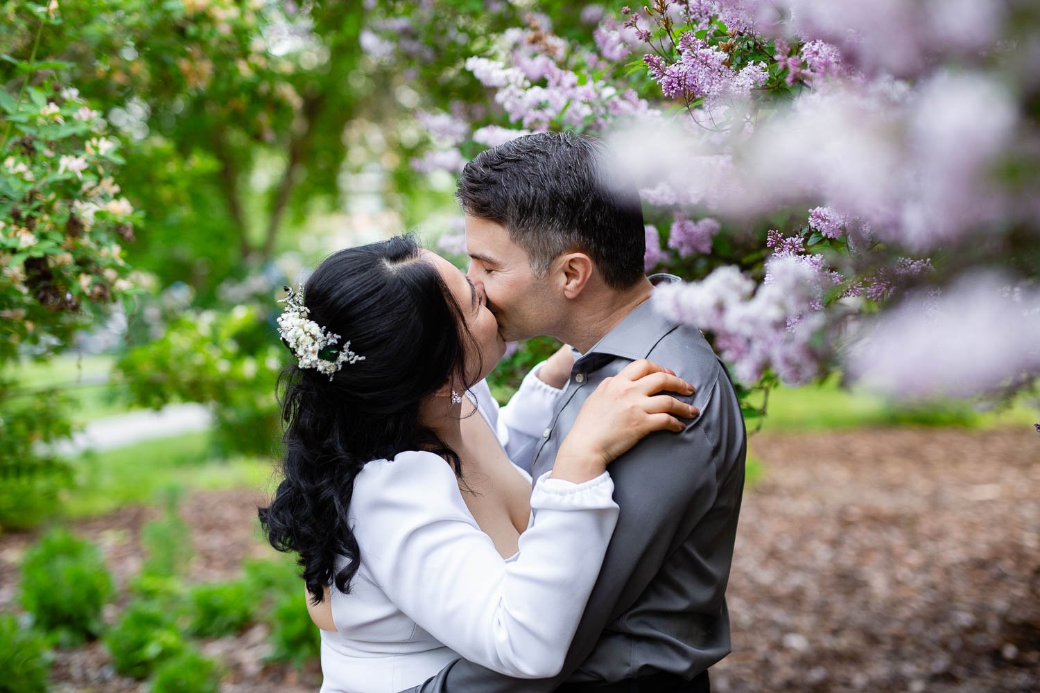 Riley Park spring engagement photography in Calgary with soft light and candid moments