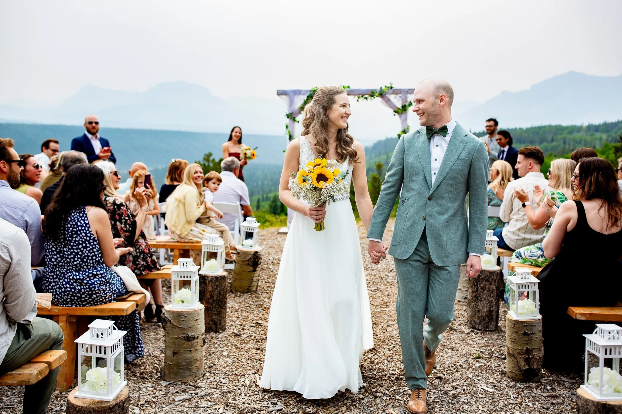 Off-grid campground wedding ceremony surrounded by mountains at Trappers Hill Lodge in Alberta