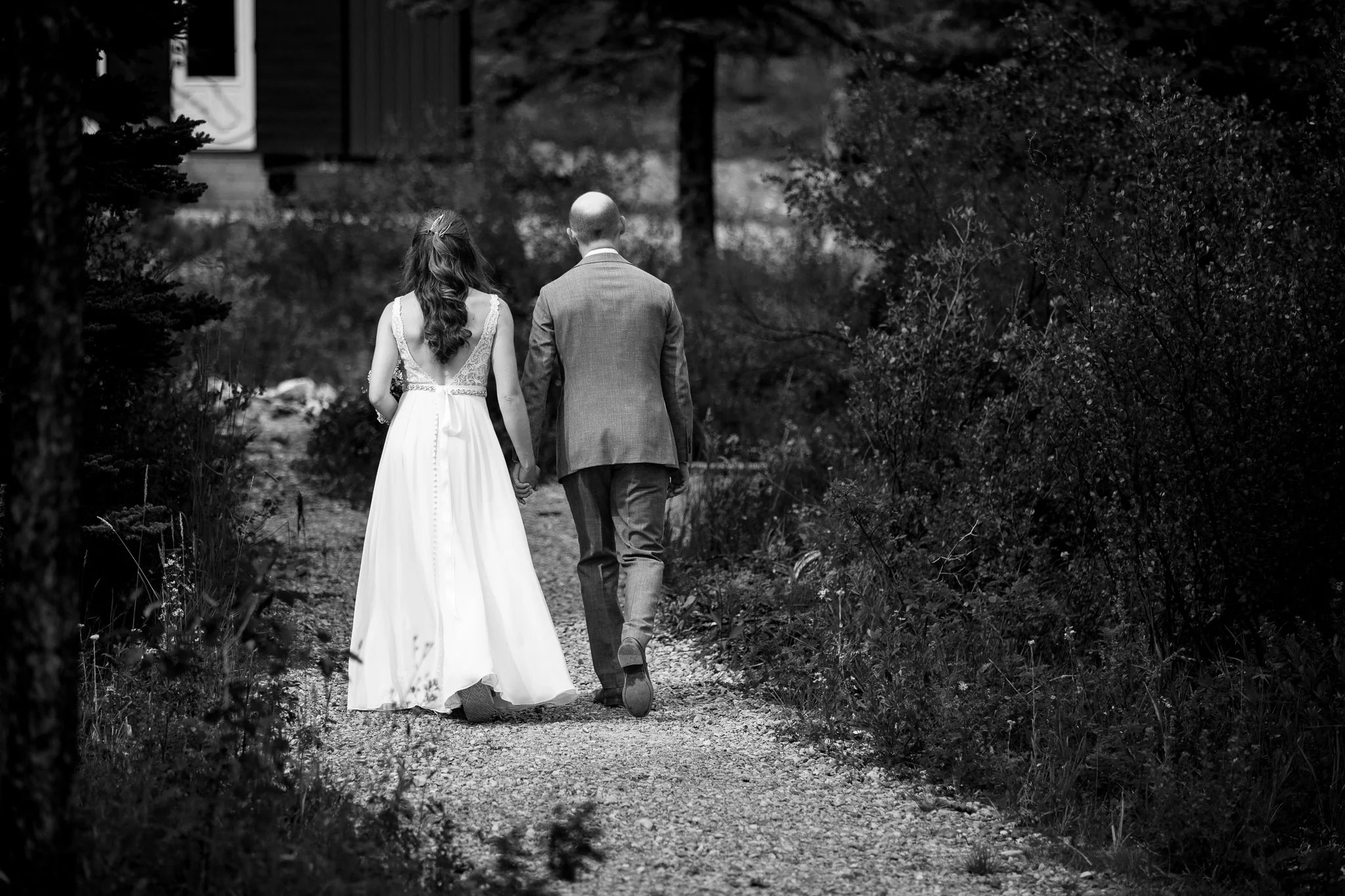 Black and white portrait of couple walking on pathway
