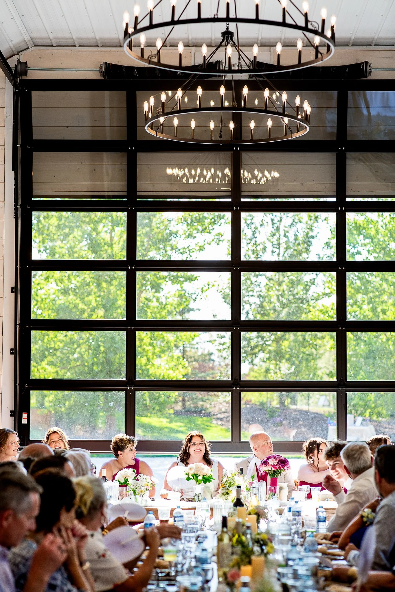 Reception inside the barn at a Prairie Lane Barn wedding, photographed by a Calgary wedding photographer