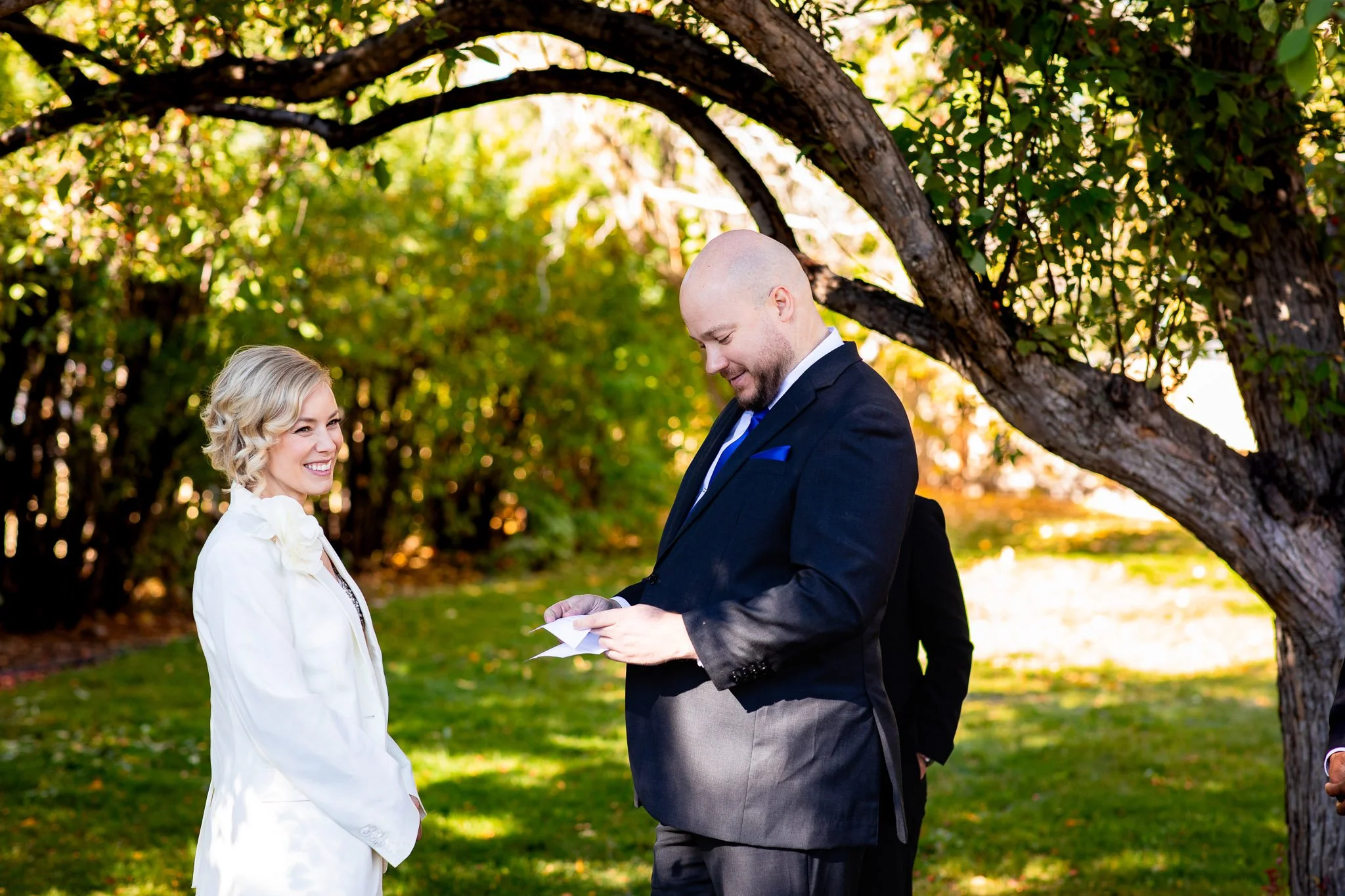 Bride and groom exchanging vows during their intimate wedding ceremony at Rouge Restaurant