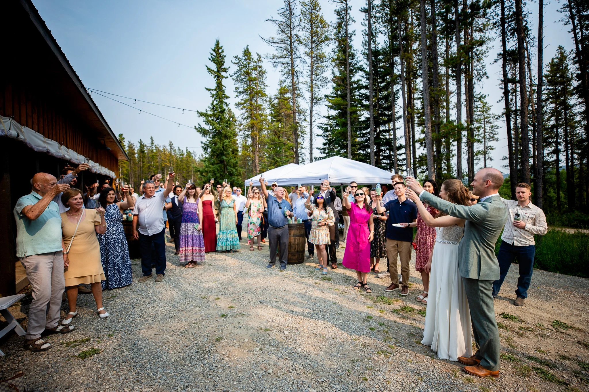 Wedding guests gathered at the campground during a weekend-long camping wedding in Alberta