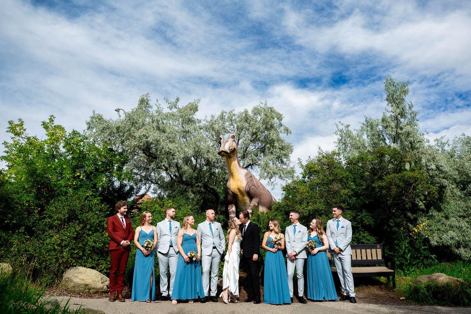 Dinosaur photobombing wedding party at Calgary Zoo
