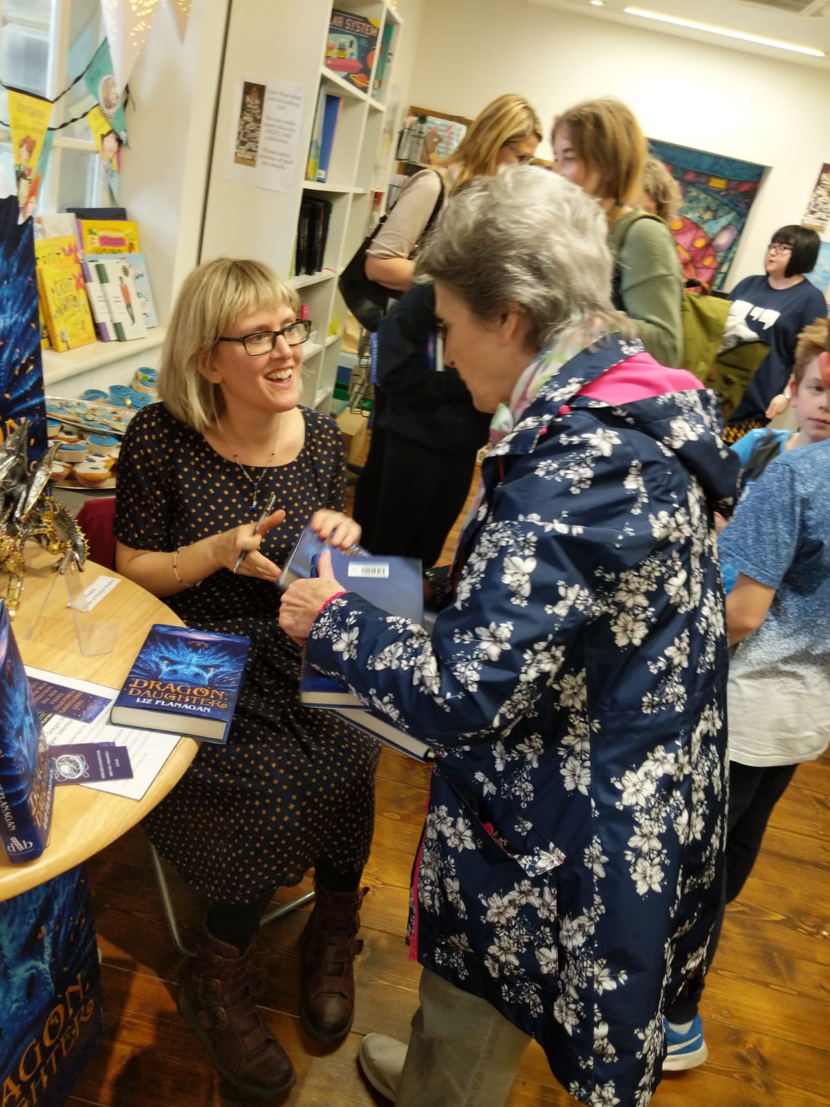 Liz book launch signing books.JPG