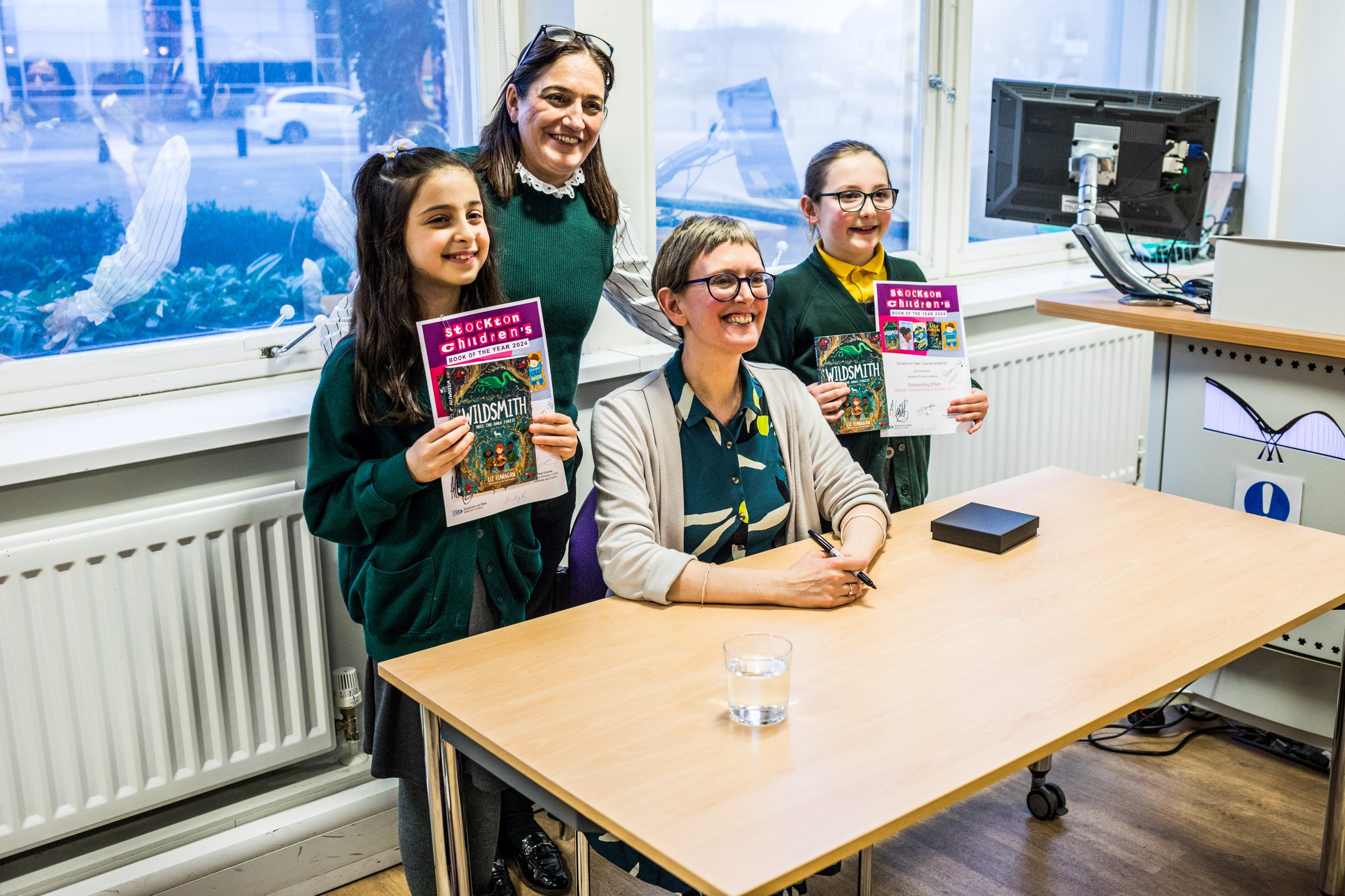 Liz w readers at signing.jpg