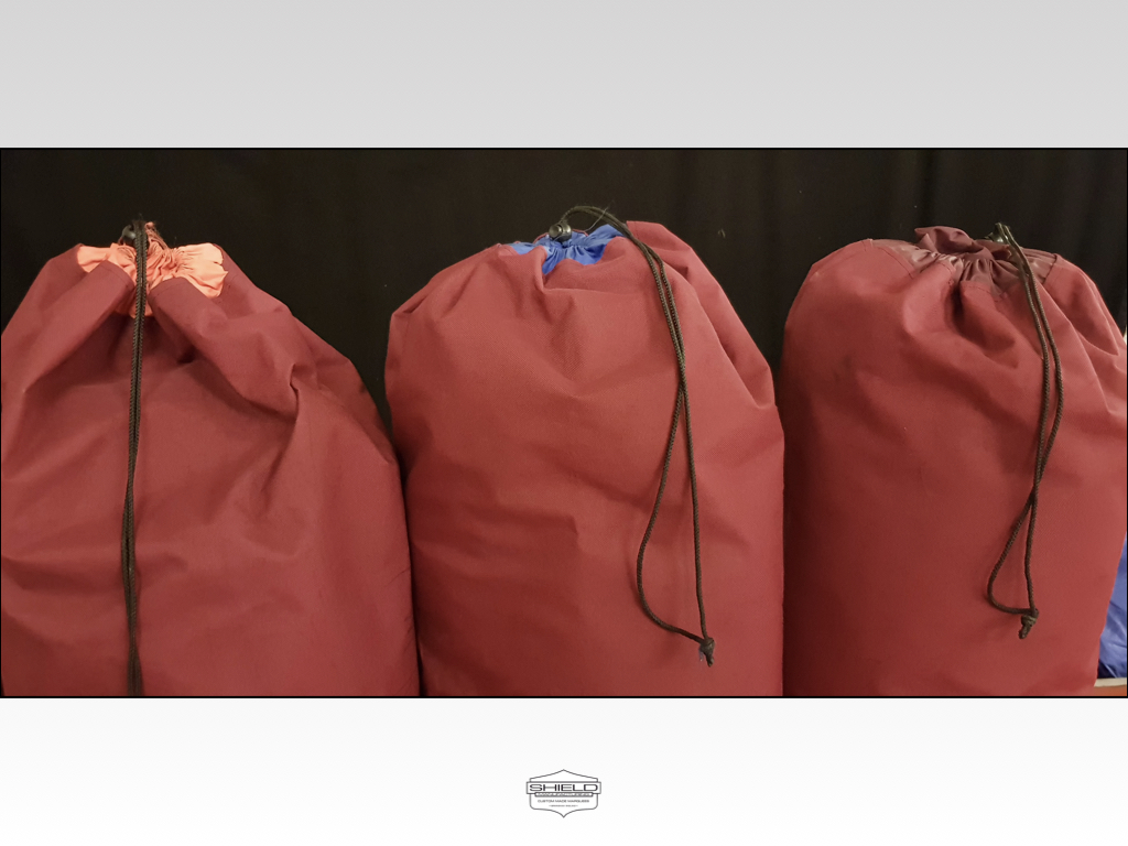 Our marquee lining bags have a common theme, the main bag colour for a given width structure is the same.