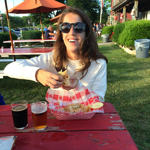 Sloane--double fisting MBC beers and eating fish tacos at St. Peter's Catch.
