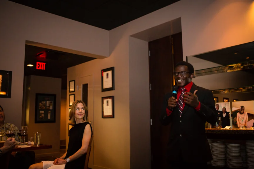 Our Restore Humanity Scholar Vincent speaking to our guests! And the lovely Dr. Allyson Mertins looks on. 
