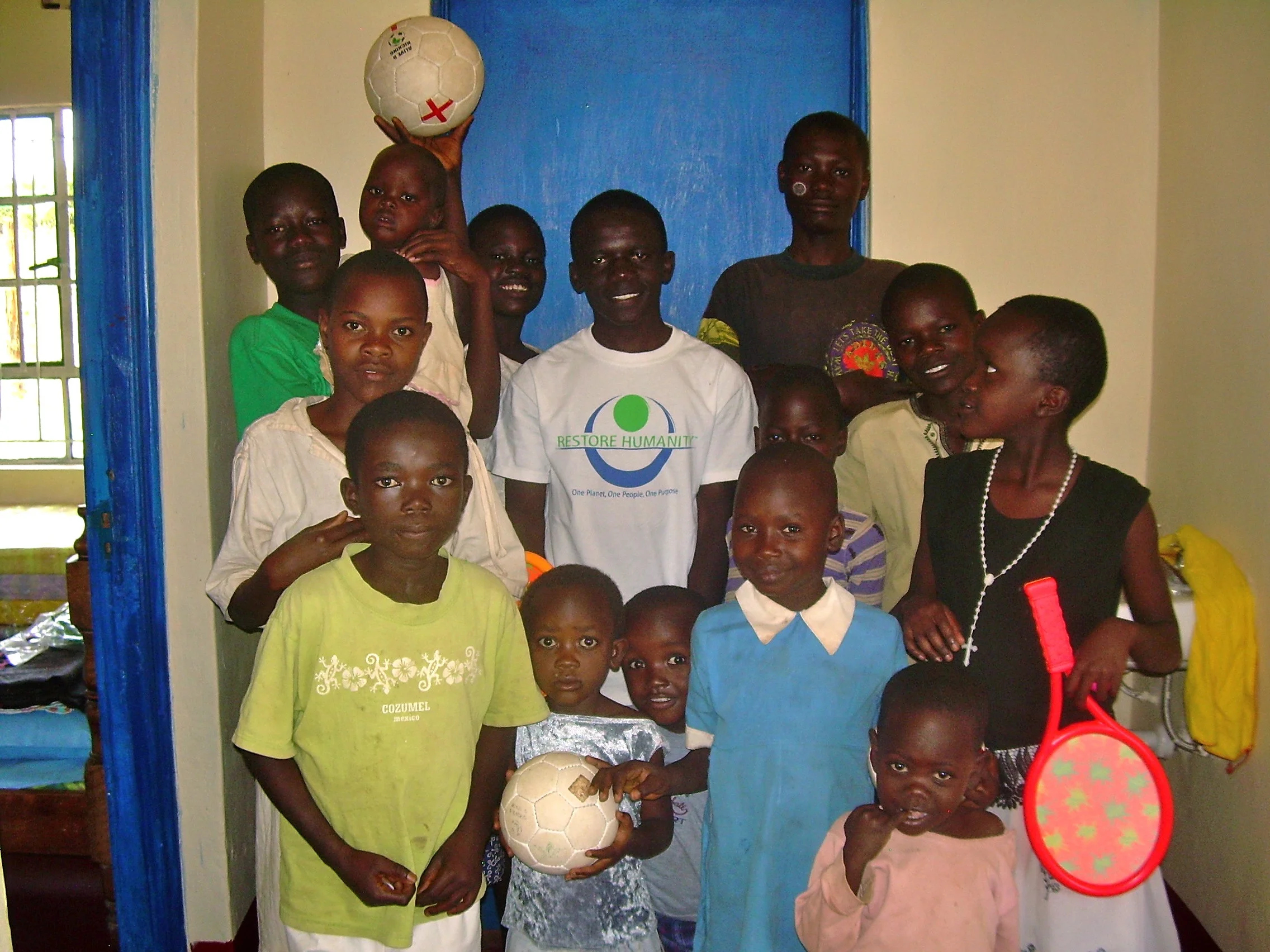 August 4th, 2010 -- Day 3 of living at JCO--Our first ten kiddos with a few friends, including Vincent (Our RH Scholar right in the middle) 