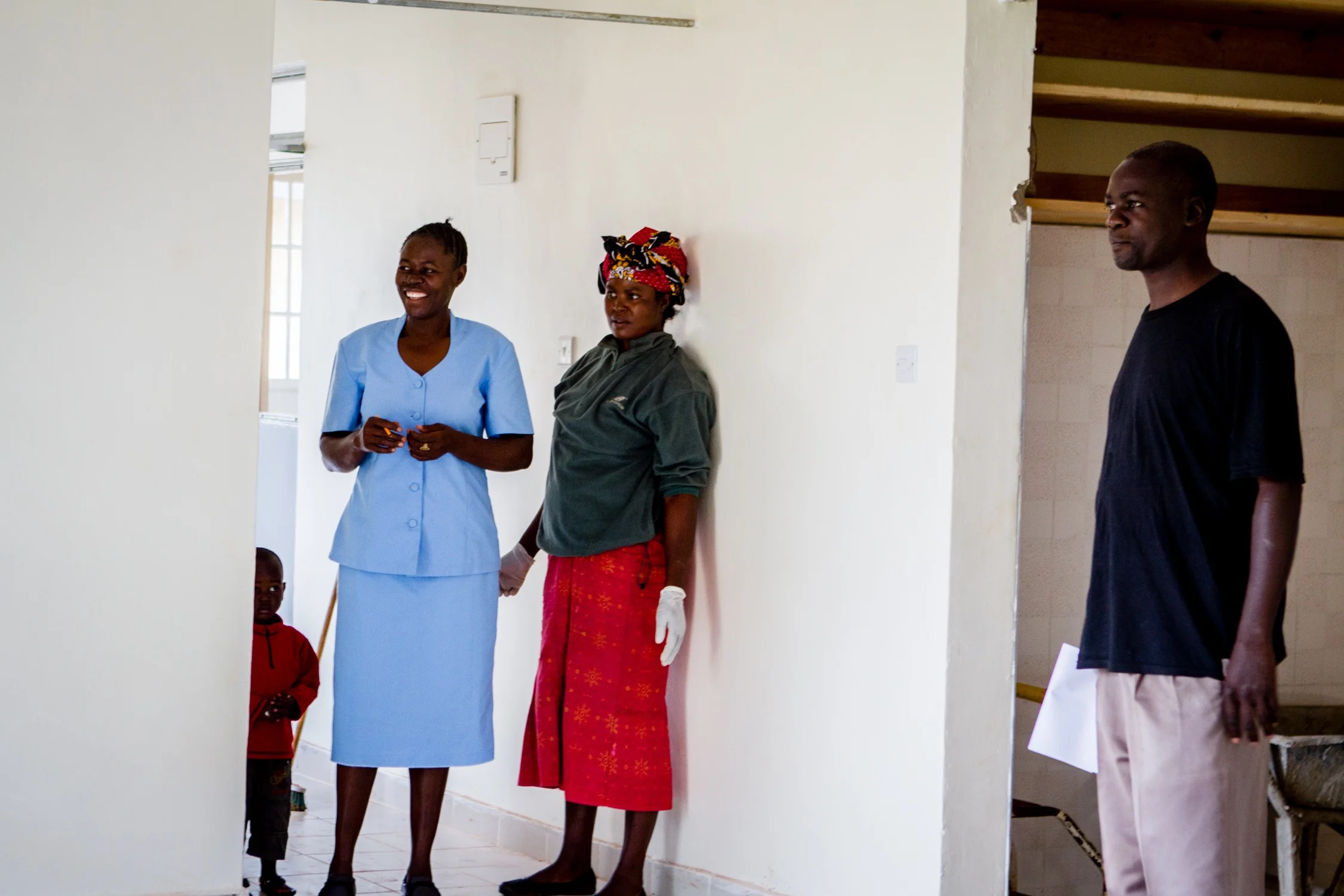 One of our favorite nurses Caroline is in the blue and the man on the right is Arthur Wamalwa, the man that made this all possible!