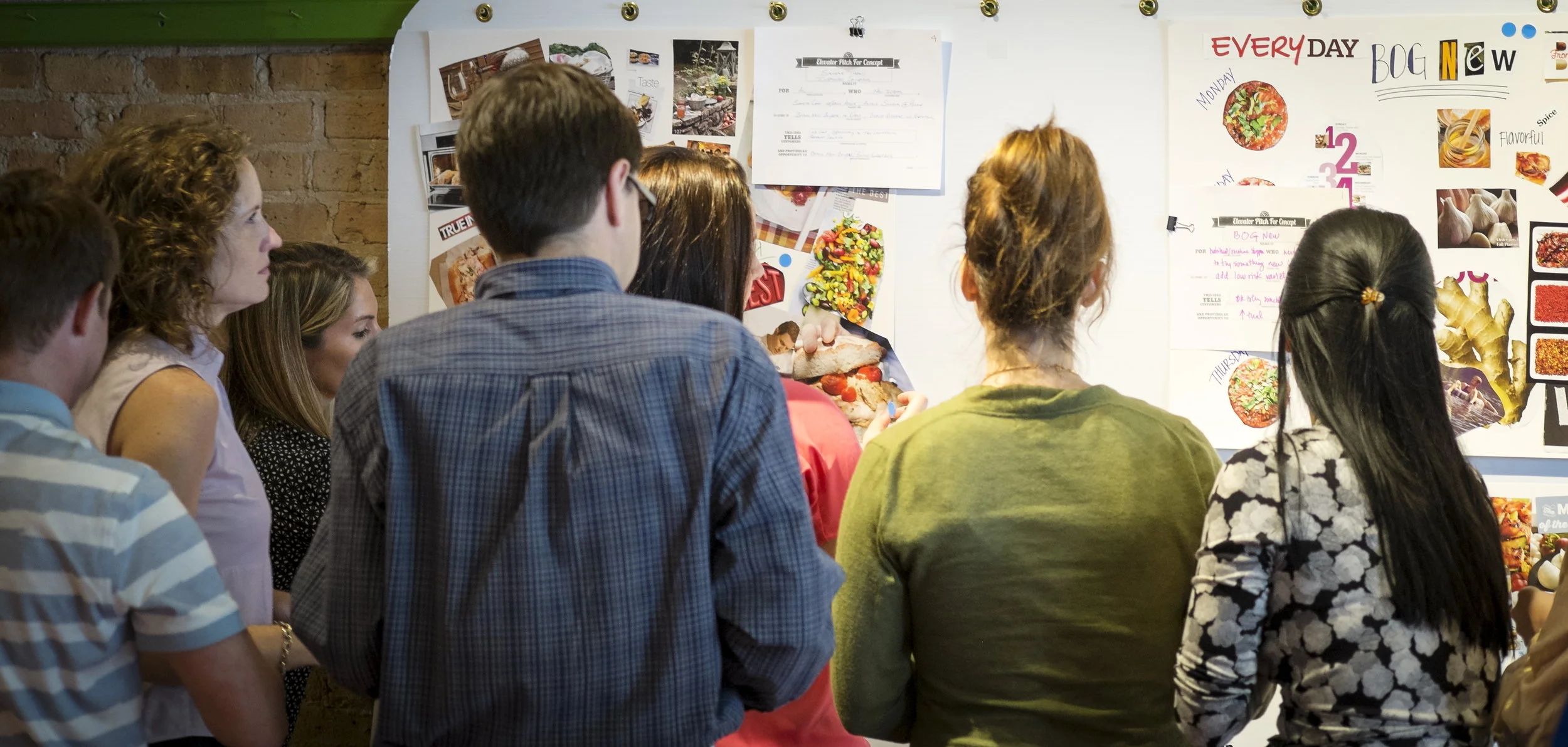 Ideation involves building on other's ideas. Here, one group evaluates another group's initial thinking before expanding on the concept with more details.