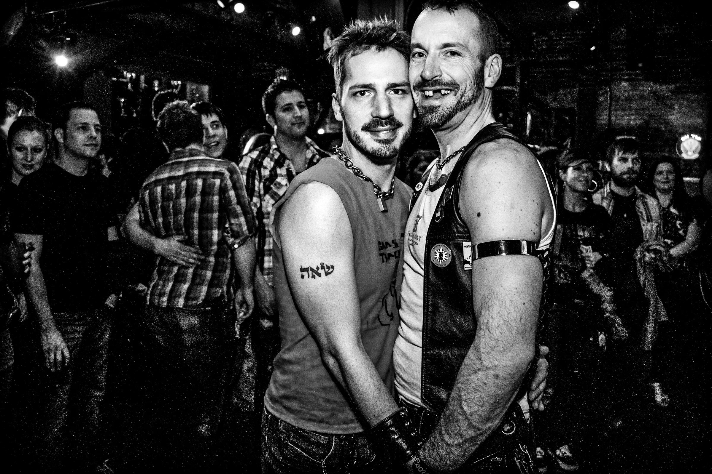Two men hold hands at R Place on February 18th, 2011, in Seattle.