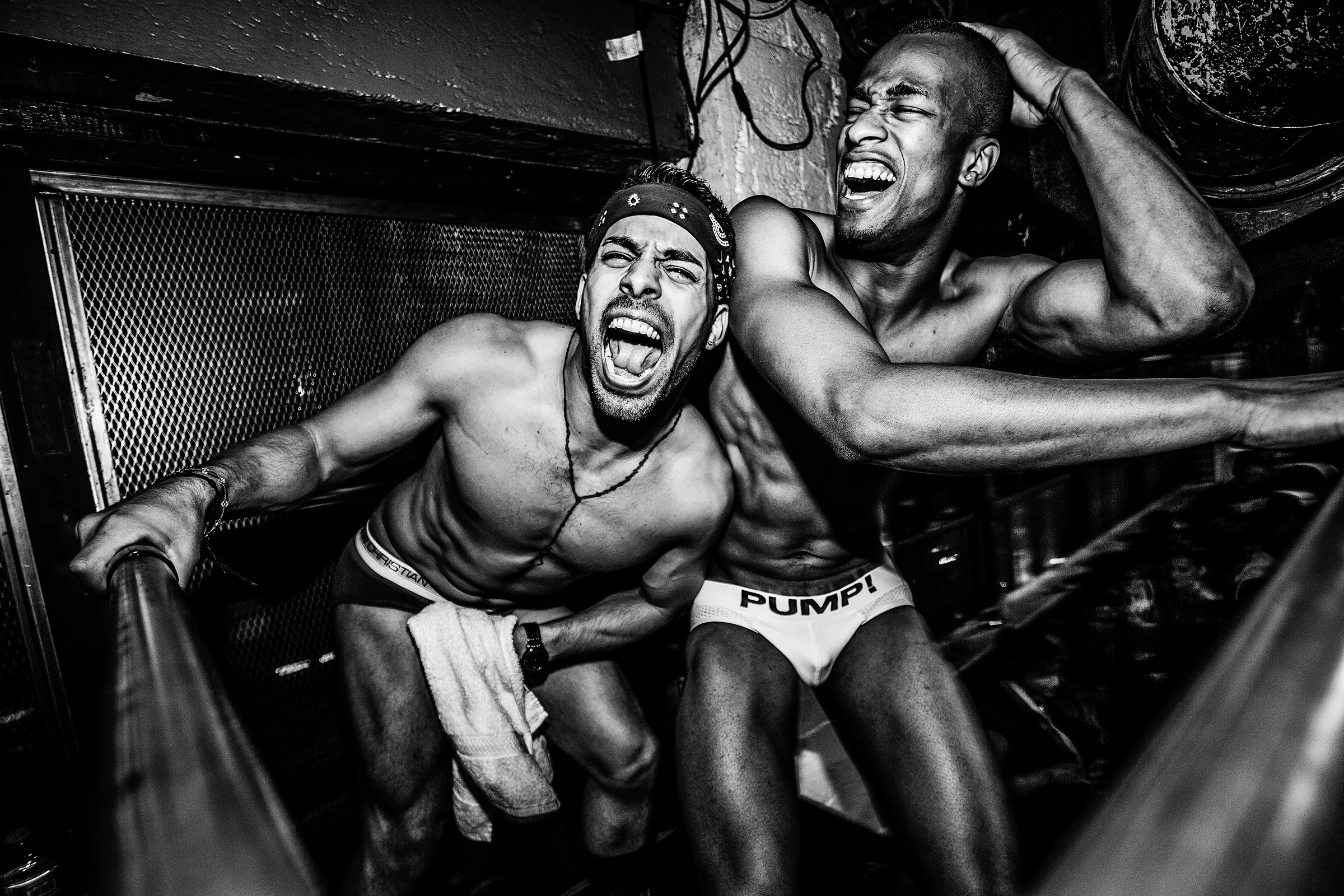 Two go-go dancers have a laugh at R Place on July 10th, 2014, in Seattle.