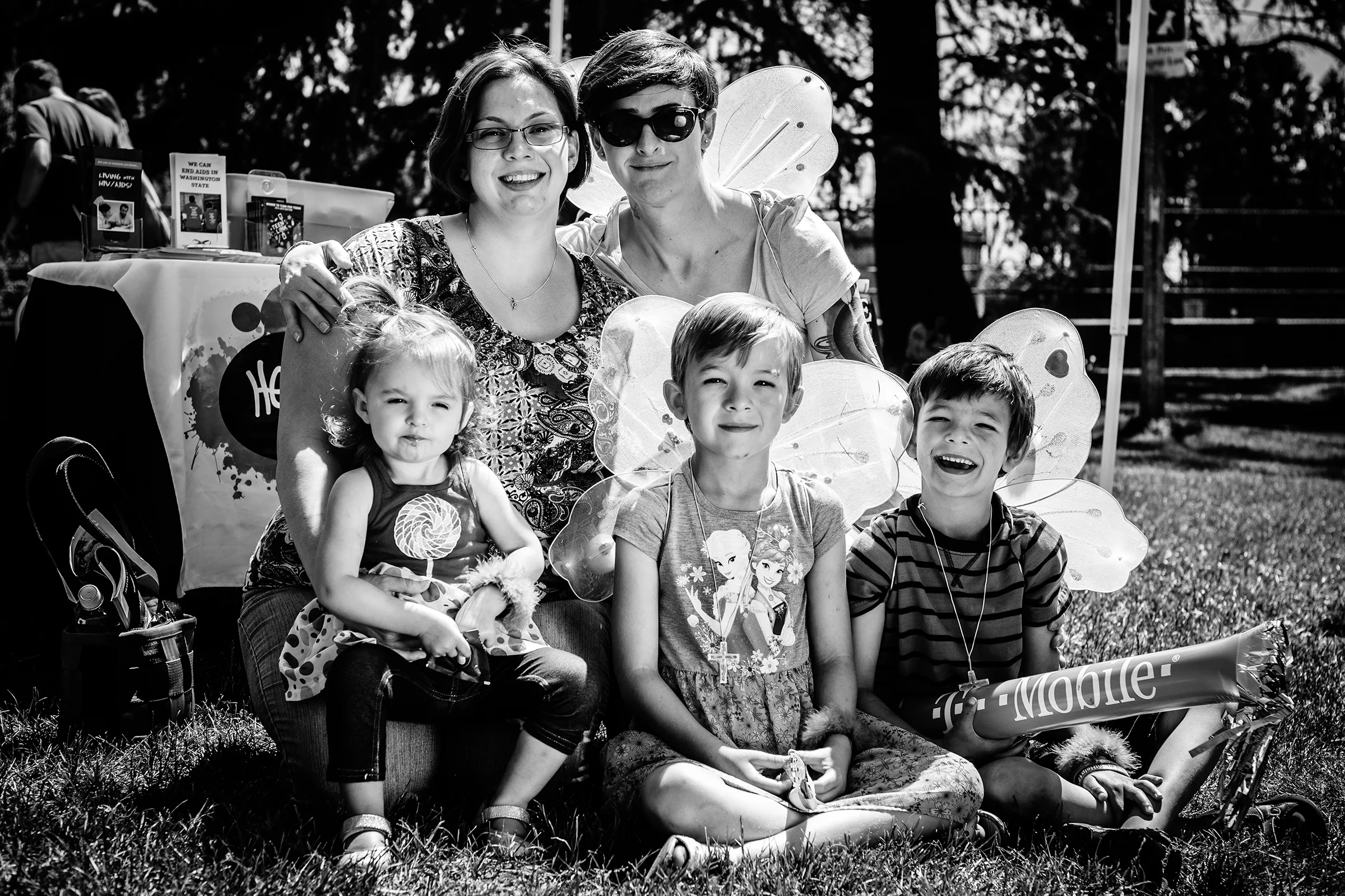 A family smiles for the camera at Seattle Pride's annual Pride Picnic at Volunteer Park on June 113th, 2015.