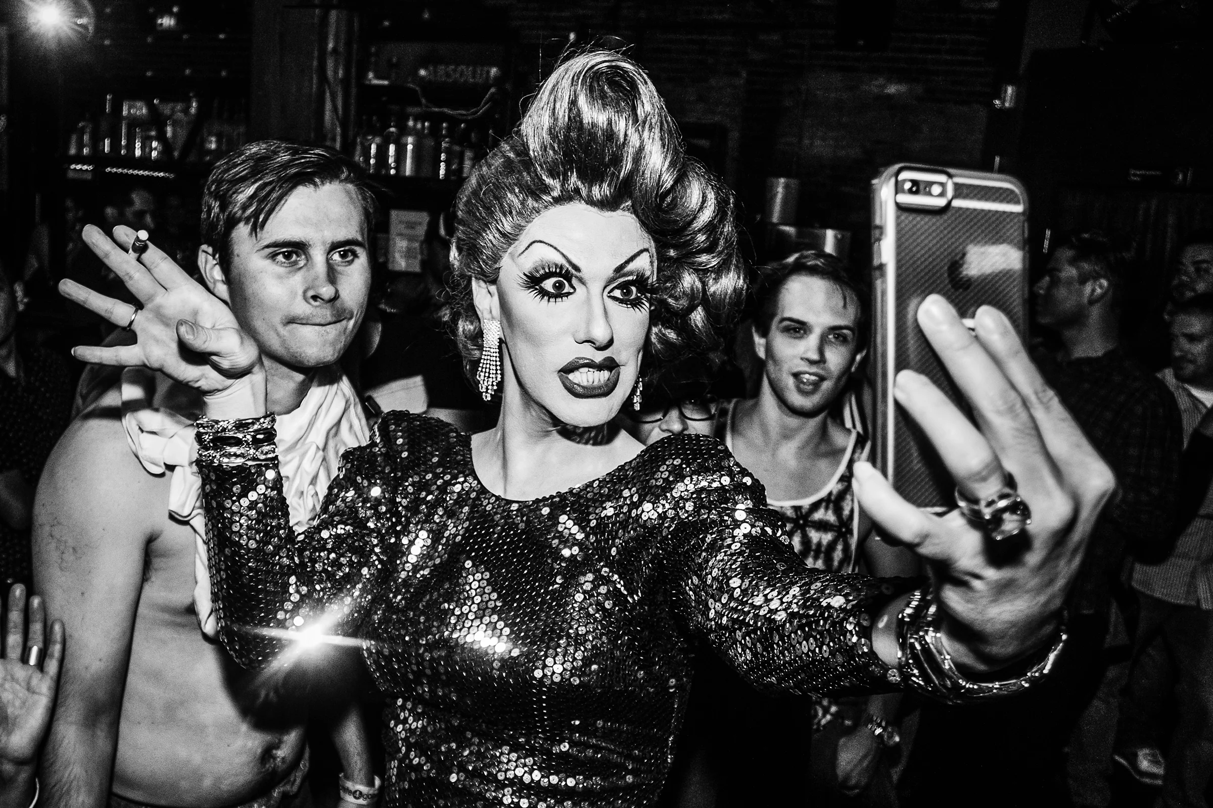 Robbie Turner, who appeared on season 8 of RuPaul's Drag Race, takes a selfie with a patron's phone during a performance at R Place on September 24th, 2015, in Seattle.