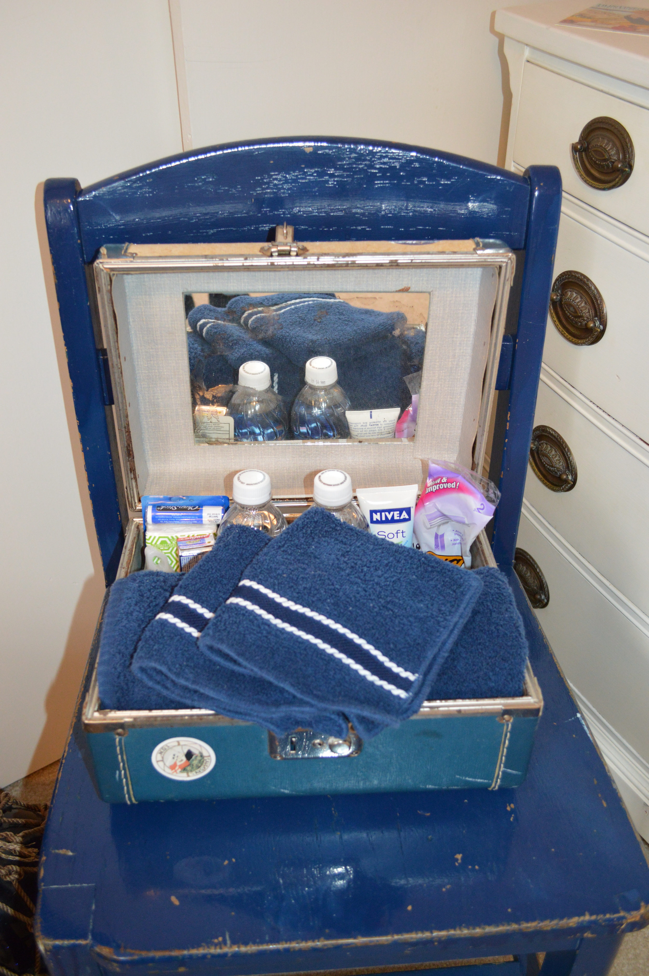 Guest amenities in old cosmetic case in nautical guest room...