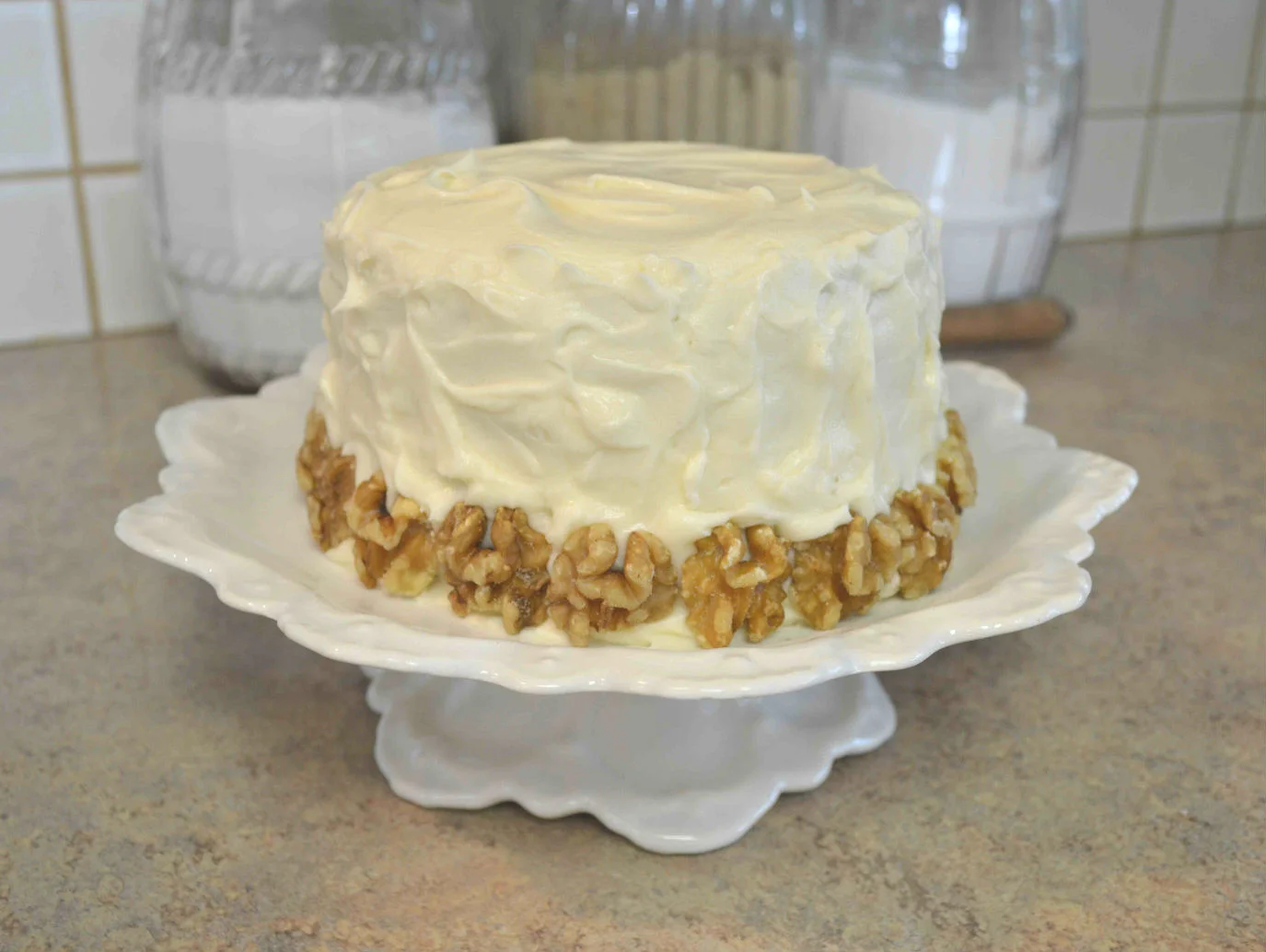 Finished...my cake layers were still a tiny bit warm so the icing is wanting to slide off...a quick plunge in the freezer stopped it....sigh...I should know better! Not the prettiest cake...but it was delicious!