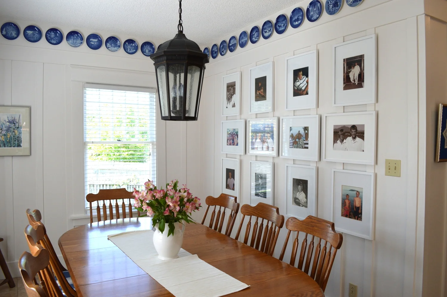 The light fixture came from Seattle Lighting and the frames for the photo wall are from Target...