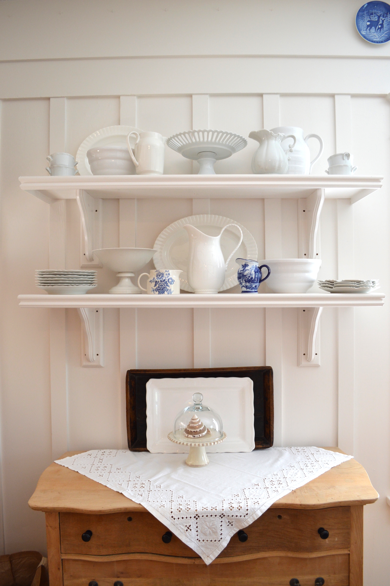 Wooden shelves and brackets came from Lowes. We added trim and painted them white...
