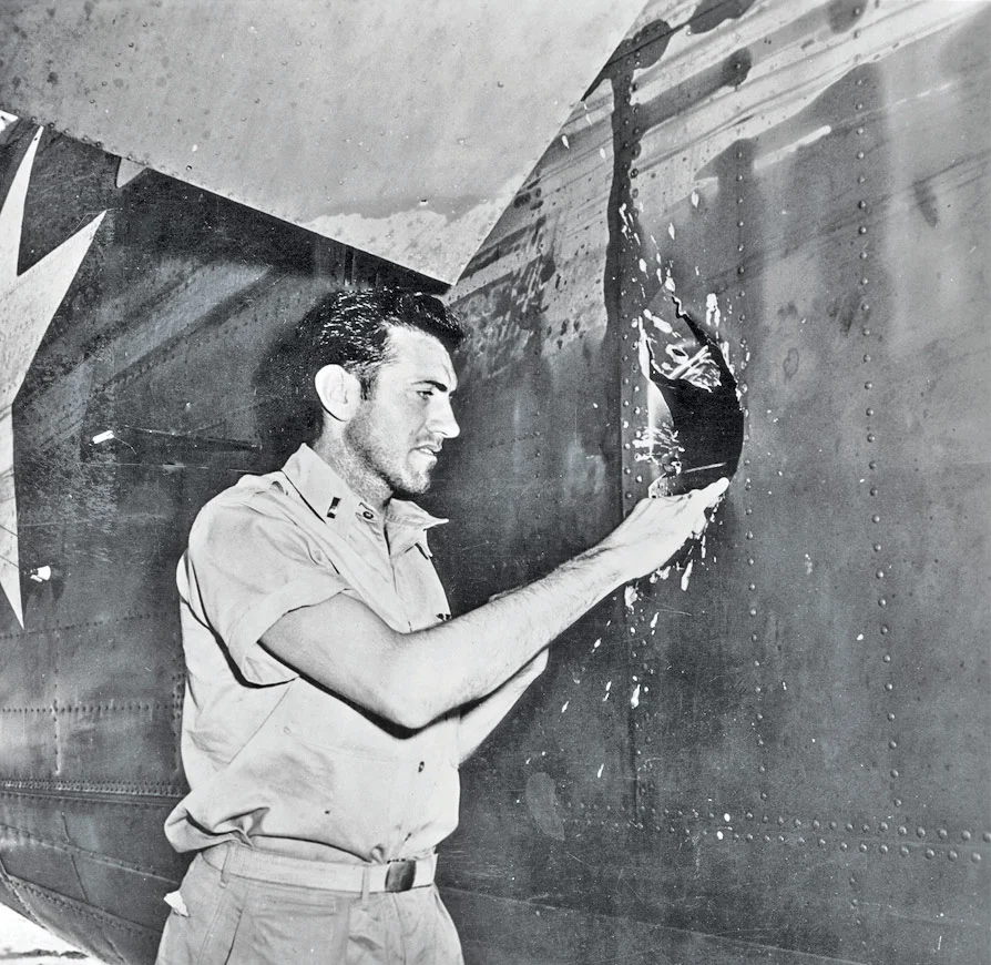 Louie, examining the damage to his plane...via google