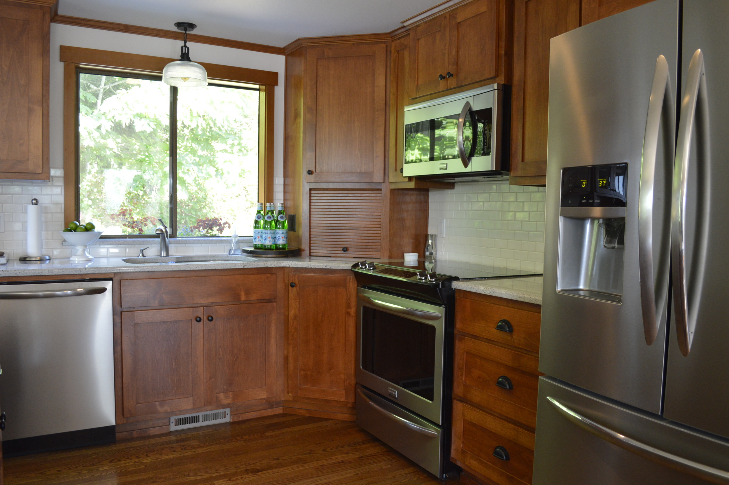 Smudge proof stainless appliances with a corner small appliance garage, new light fixture...