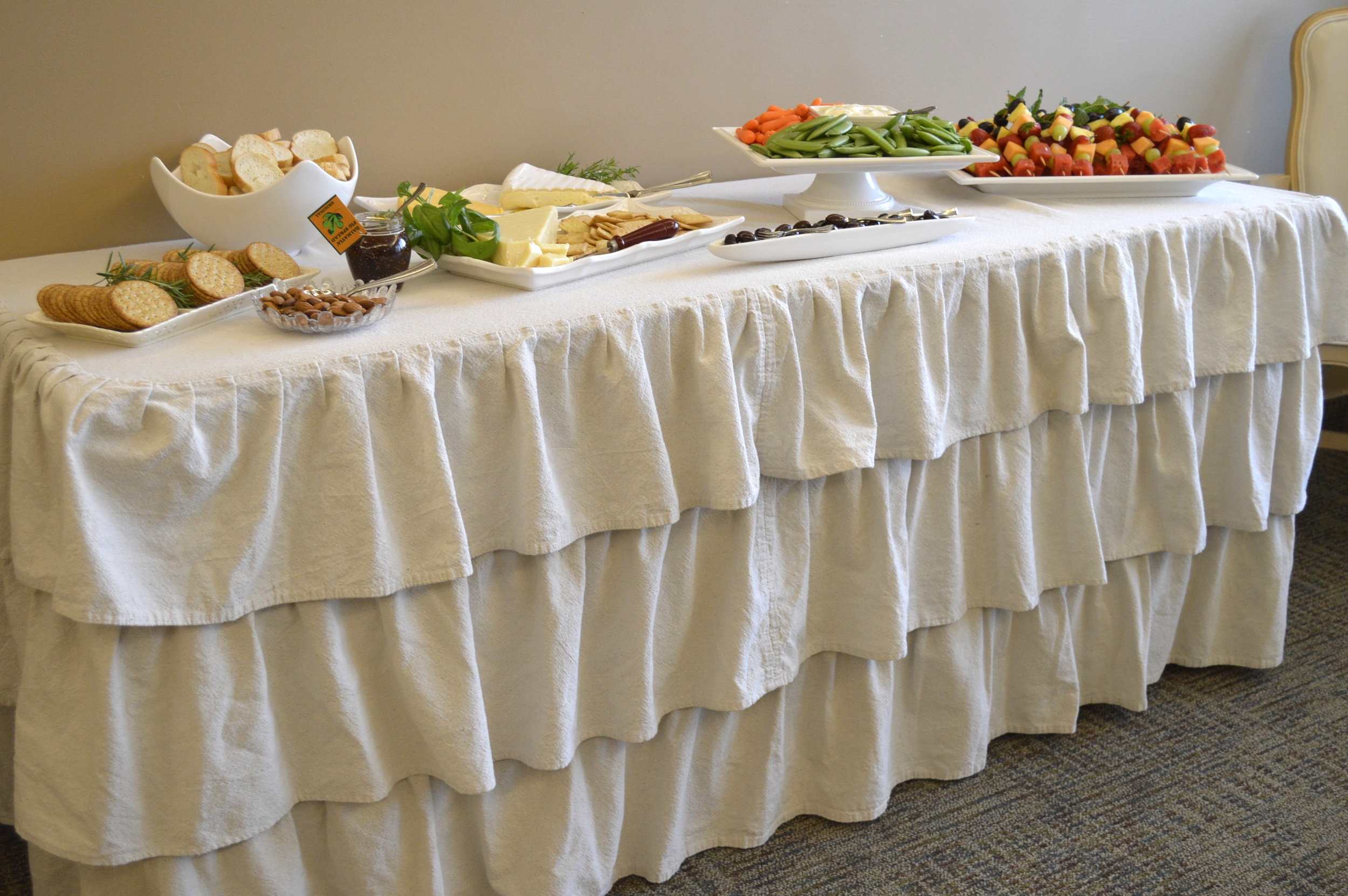 Assorted cheeses and crackers, nuts, olives, fresh veggies, and fruit kabobs...