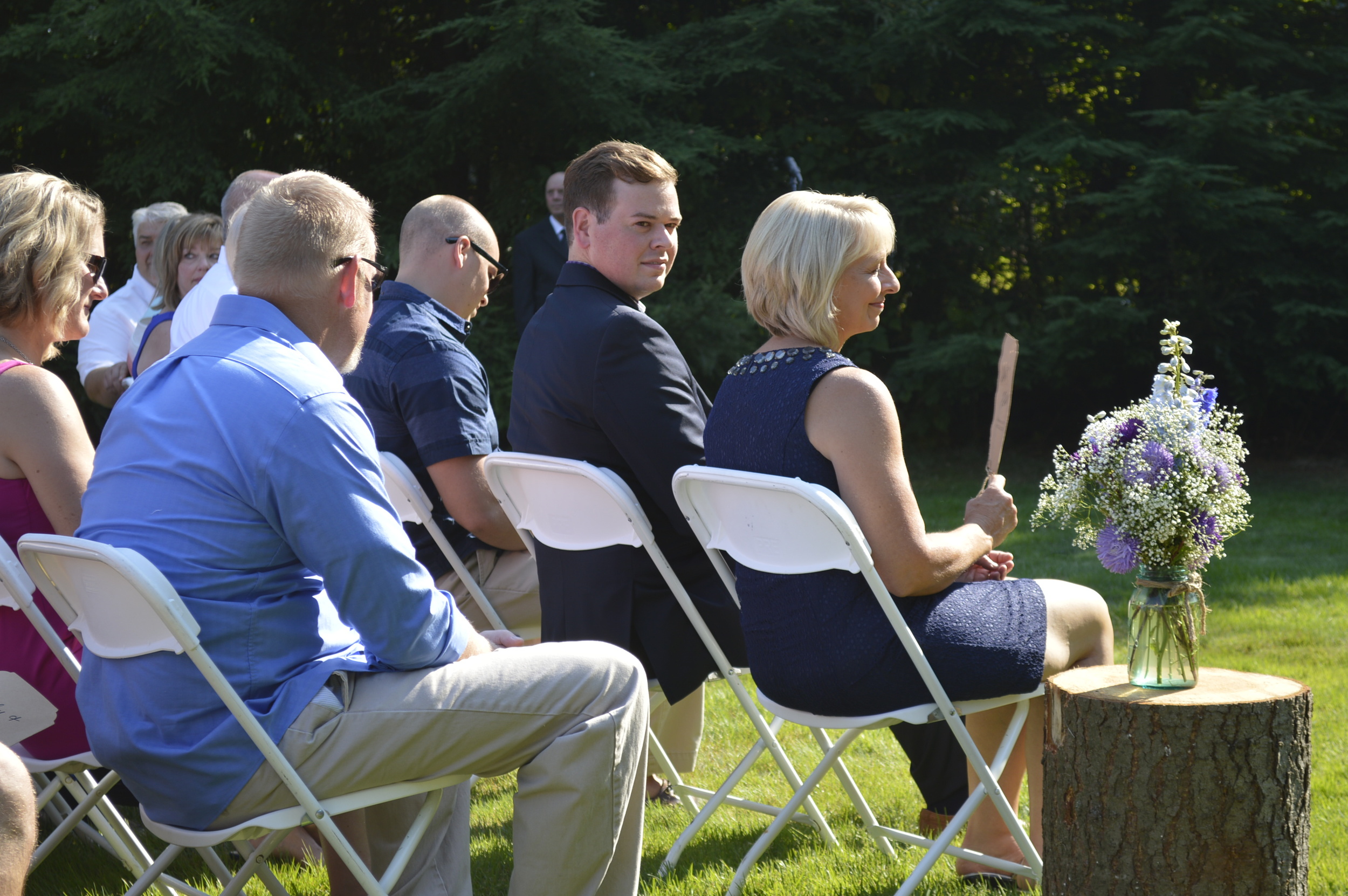 The beautiful mother of the bride, Lori, with her handsome sons, Josh and Isaac, beside her.