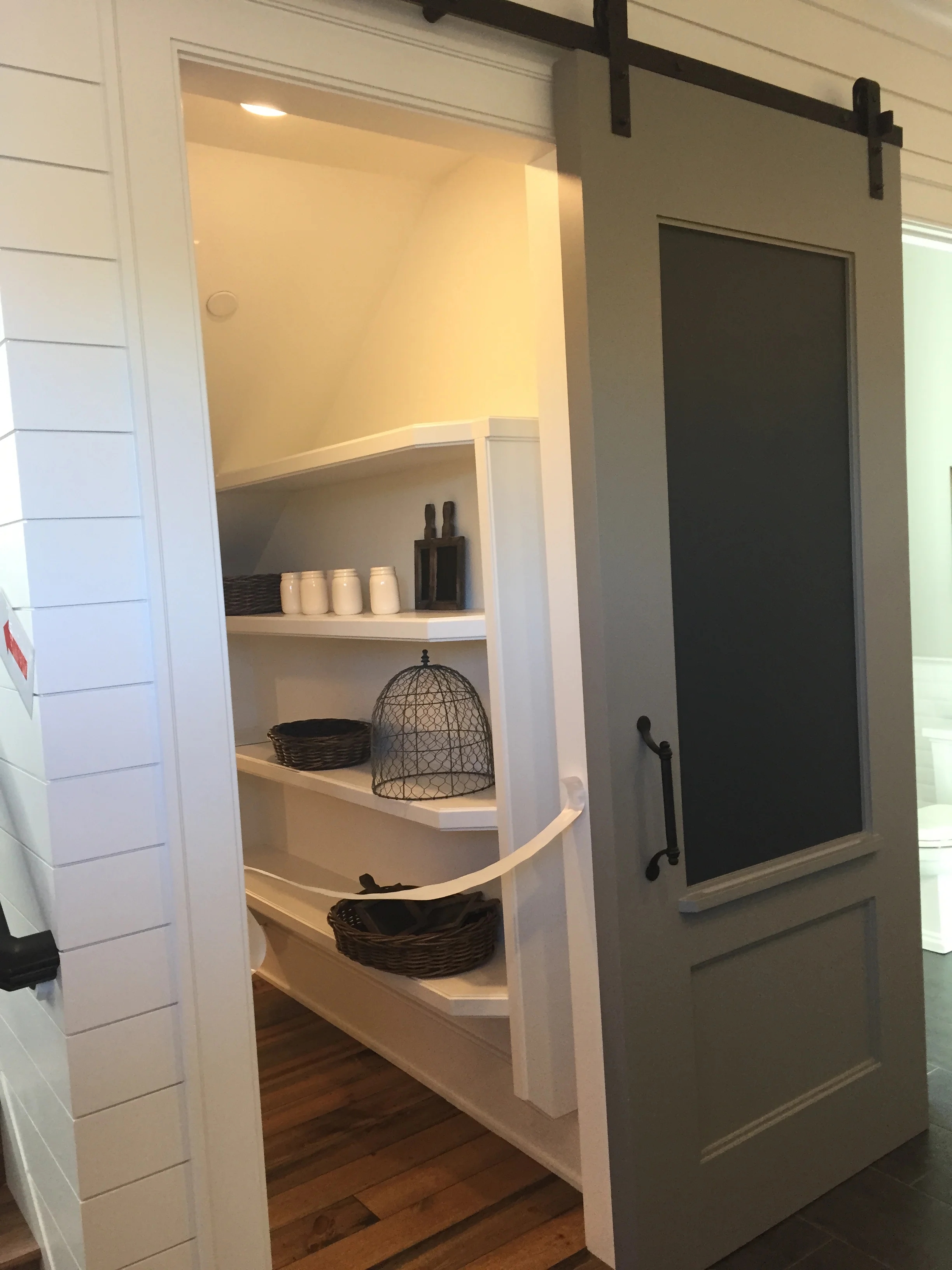 Cool barn door with blackboard opening to the pantry...