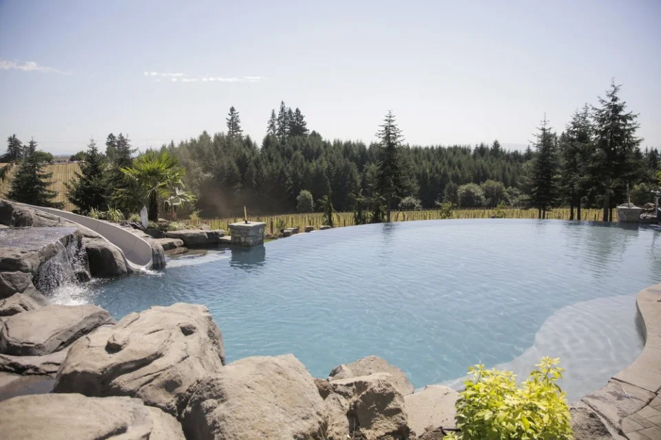 The amazing infinity pool with a concrete slide to the left...(Photo source Oregon Live)