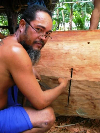 Photo 2 Adzes are used to slowly remove wood forming the hull.jpg