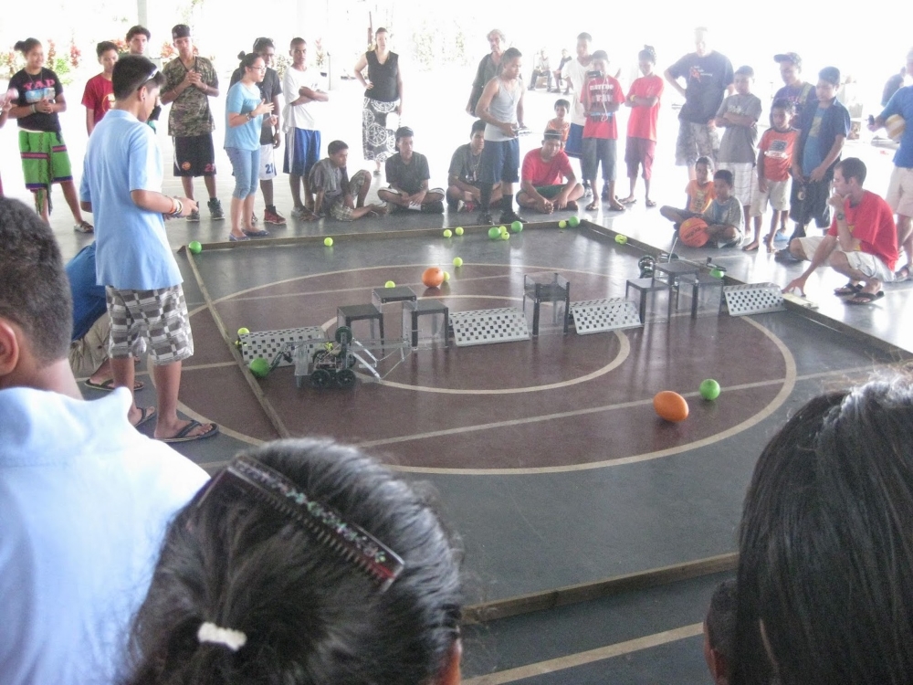 Yap Catholic and SDA School robots battle to push as many balls over the wall before the buzzer