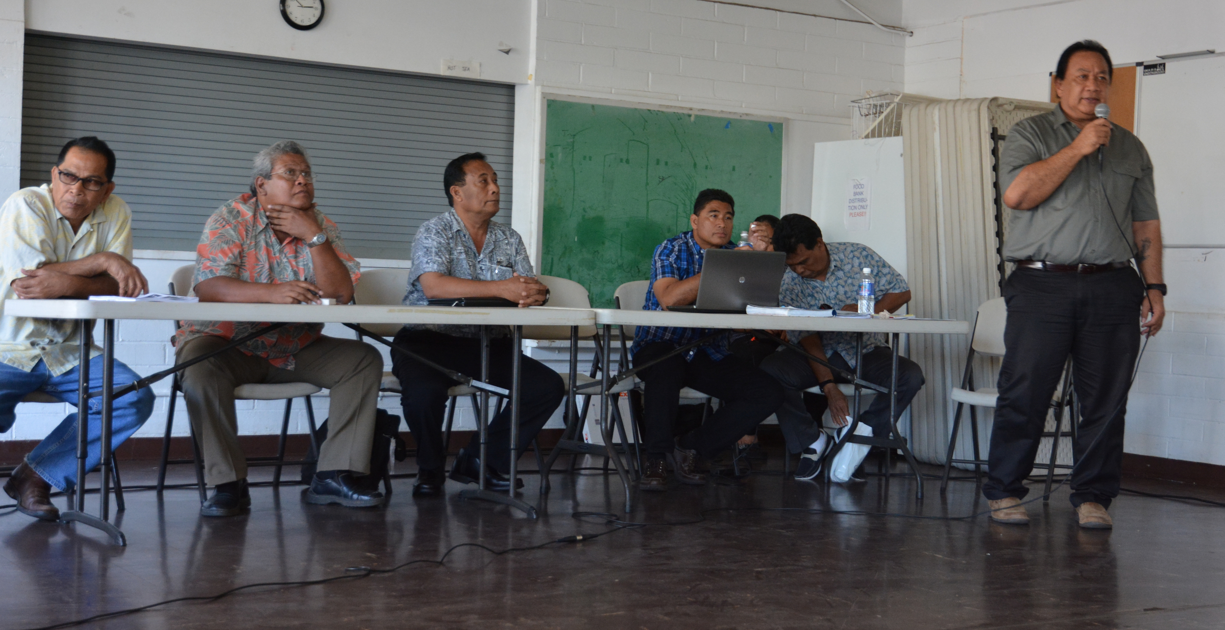 Mark Mailo gives his opening remarks at the Honolulu hearing. (L-R; Jacob Esah, Winiplat Bisalen, Carsom Enlet, Johnny Meippen, Julio Marar, Mark Mailo. Not pictured: Sabino Asor.)