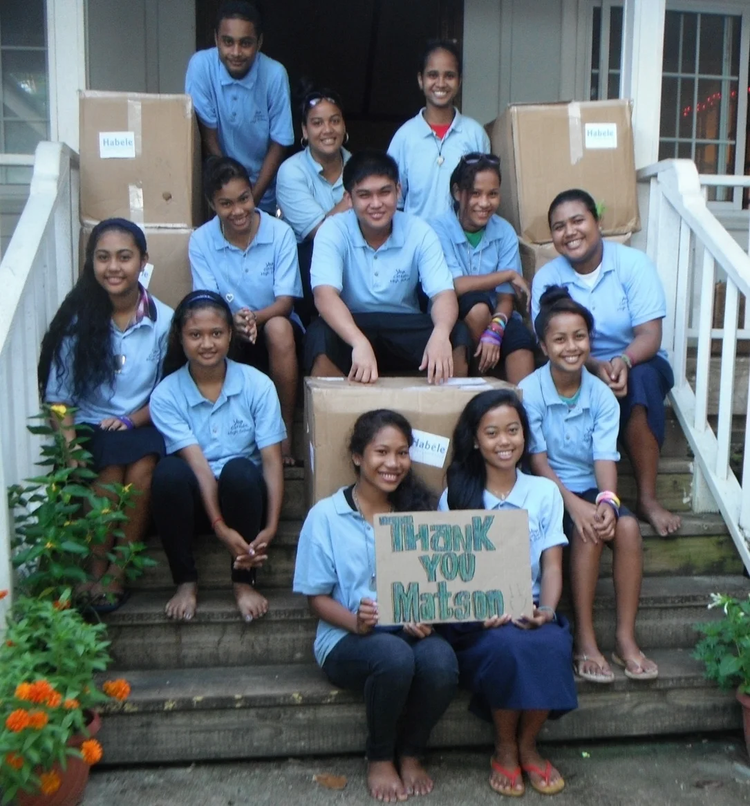 Students at Yap Catholic with boxes of donated robotic equipment facilitated by Matson