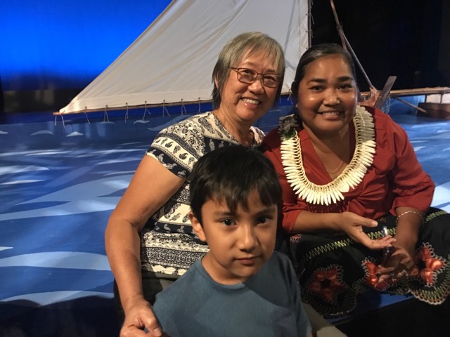 From left to right: Mom, nephew, and Innocenta Sound-Kikku, one of the lead actors. On the set of Masters of the Currents.
