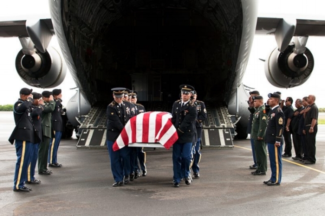 The body of Sgt. Sapuro Brightly Nena, arriving in Kosrae.