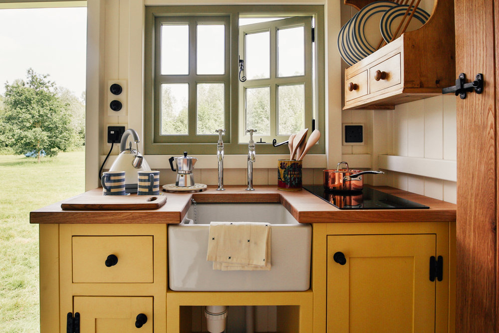  Interior photography of shepherds hut guest room kitchen with butlers sink 