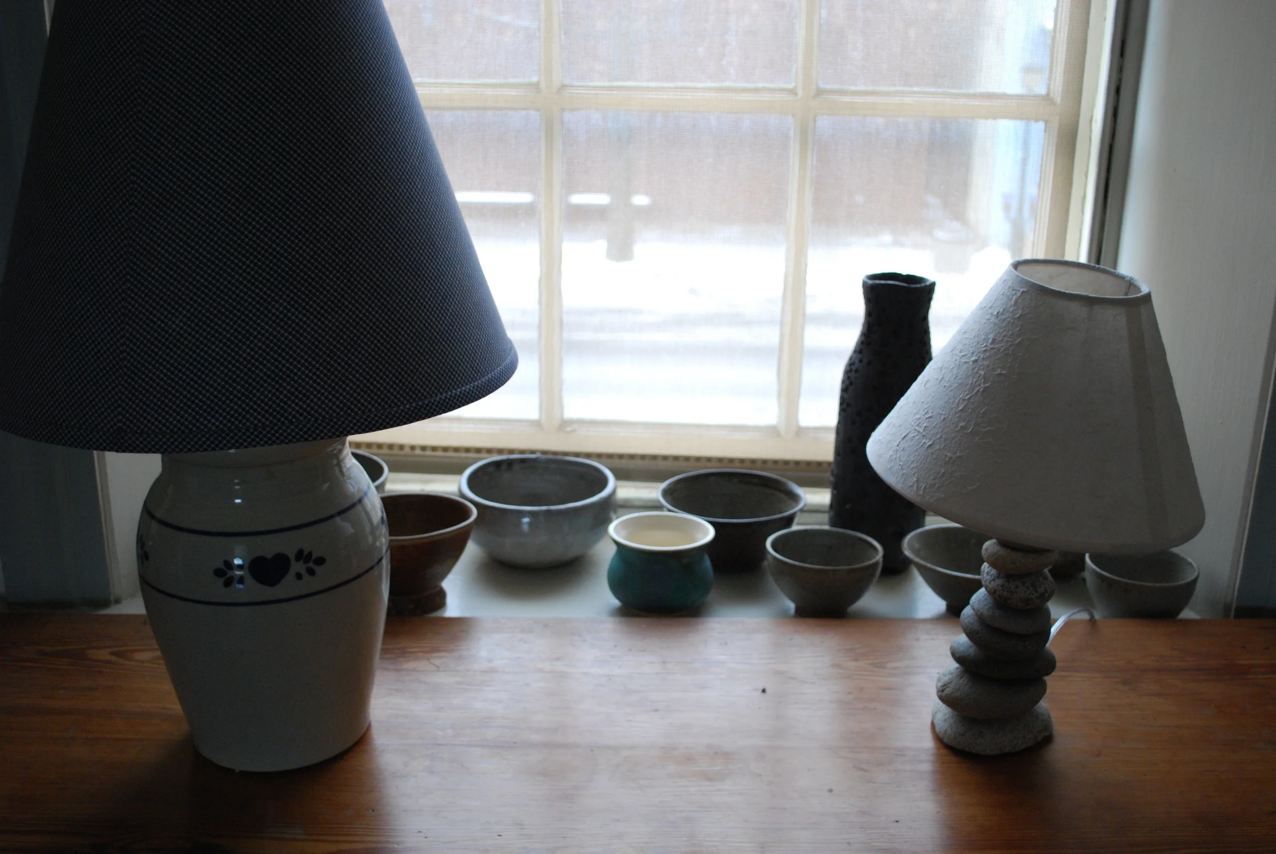 upstairs window with staff-made pottery