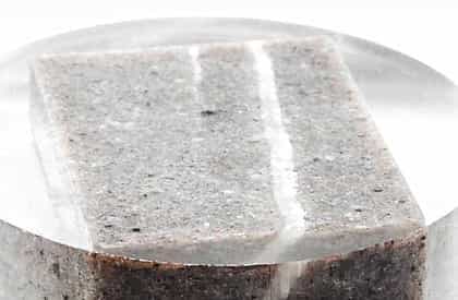 30 mm polished resin puck of a sandstone block.