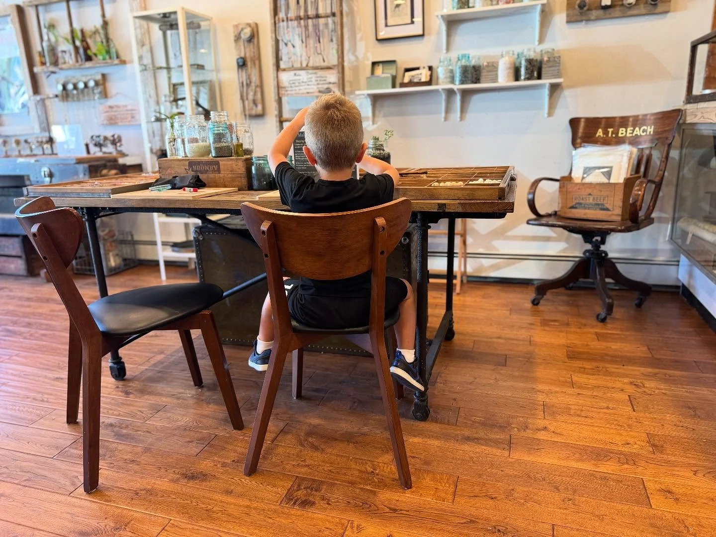 Our sweet friend Cain popped in with his mom, grandmother and new little brother to make a bracelet! He chose everyone&rsquo;s zodiacs (dad&rsquo;s too) and a skull for Jack Skellington. 💀 We&rsquo;re open today till 6, come make yours too! #rebecca
