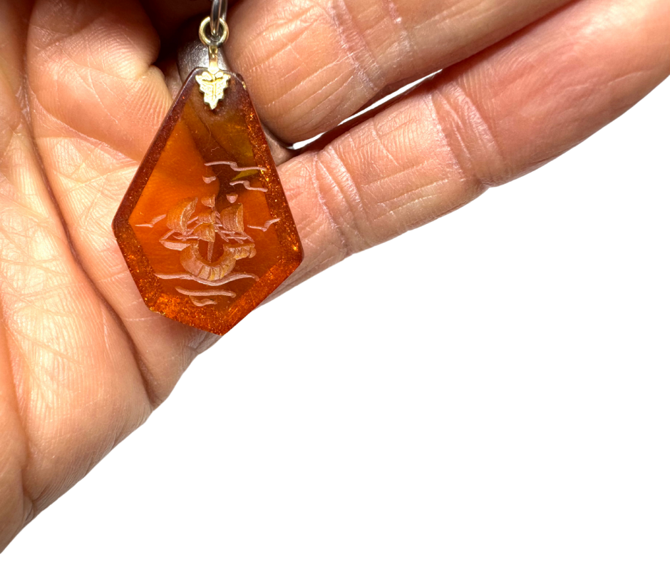 Amber Resign Ship Pendant - 1.png
