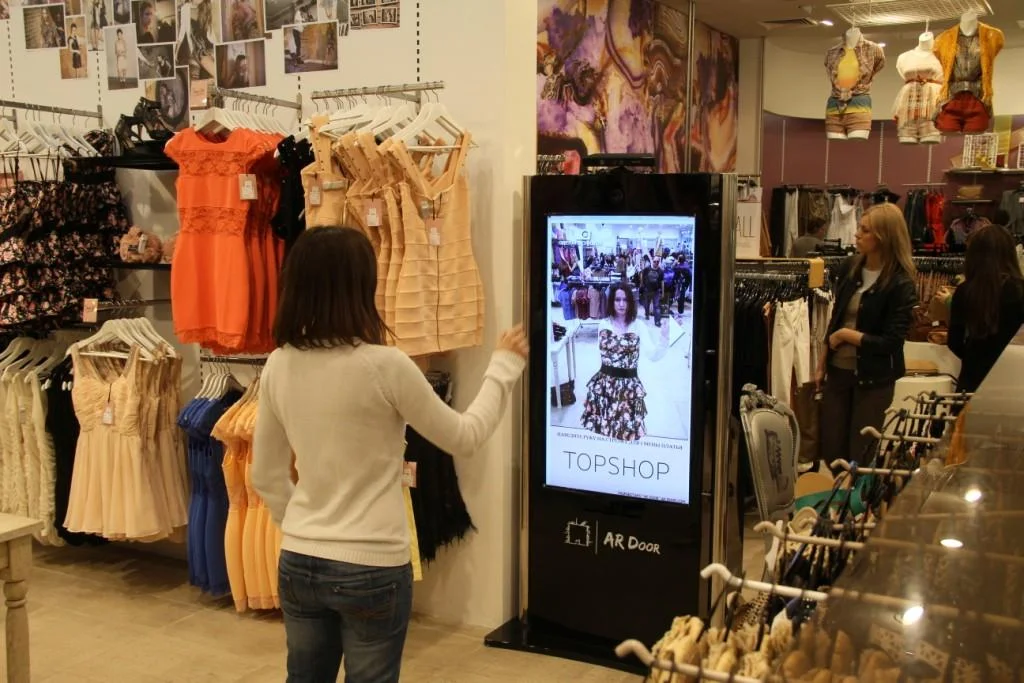 Select several garments off the rack and the virtual fitting room at Topshop allows you to see yourself onscreen with your clothes. The built-in camera tracks a person’s body and superimposes over it a 3D model of the dress. Perfect for the preliminary ‘wonder what this would look like on?’ shopping stage - No lines, no hassle and no stress for the customer and no clean up and rehanging for the store clerk! Of course, once you found your favorites, you’d need to try on for size before buying. But definitely cuts the time in half!