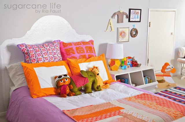 The quilt was handmade by Aunt Remi in
Seattle. Cool Bear was a gift from Uncle Roy in San Francisco. The silk
elephant was from L'Indochine boutique in Manila. Lion was a gift from
Aunt Julie in San Diego. Bedding from Serena & Lily. Table lamp and rug from Land of Nod.