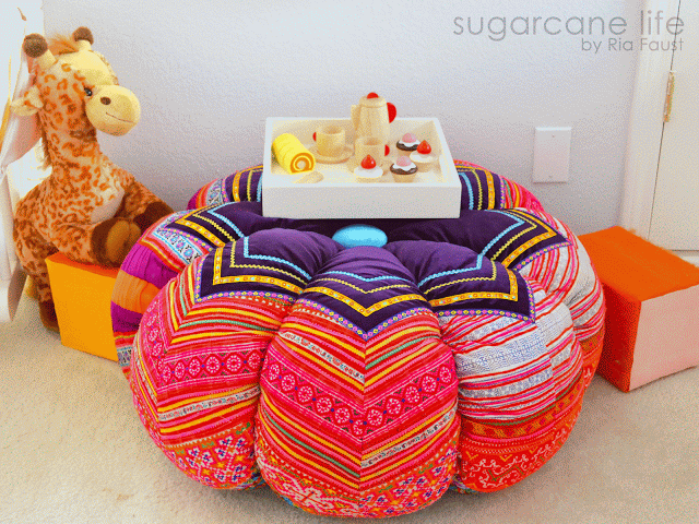 A hand-embroidered ottoman serves as a table. It came from the Hmong
Tribe in Thailand, transported to Manila via L'Indochine boutique's inspiration seekers , and
then flown to California
specifically for Amelia's room. It's kinda the crown jewel piece of the room, right?