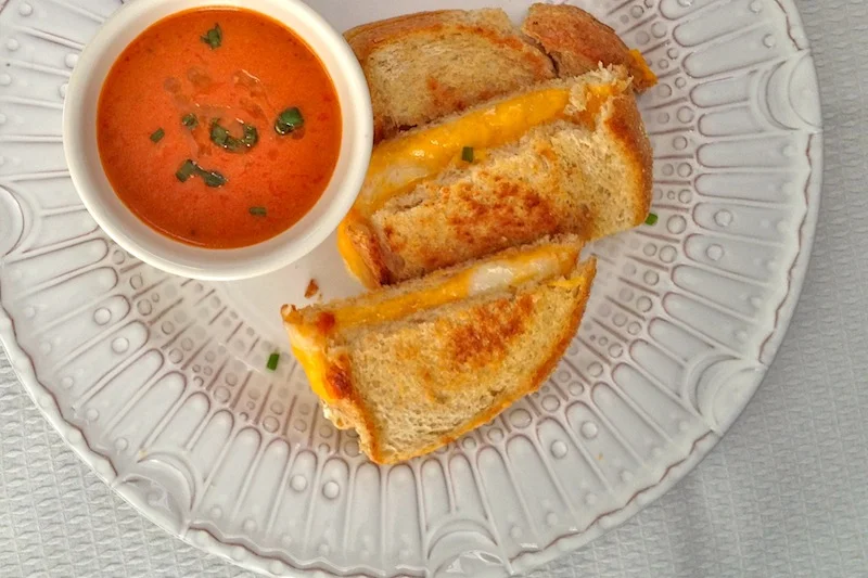I use sliced French bread, mild cheddar, and sottocerene with truffles. Throw butter in the pan and cook for 3 minutes on each side, until the cheese is melted and the bread is crunchy and golden.
