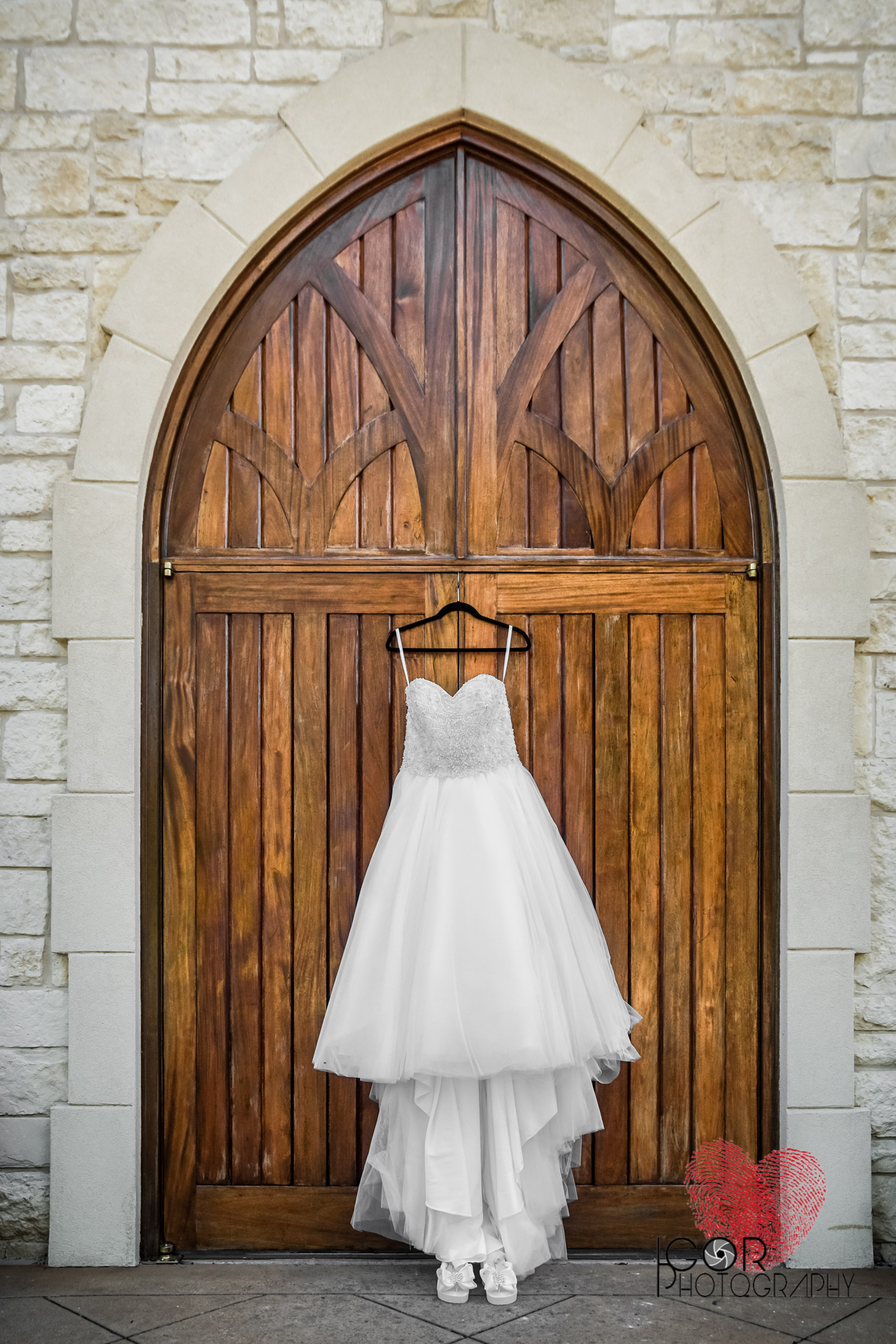 Wedding dress hanging at the chapel door