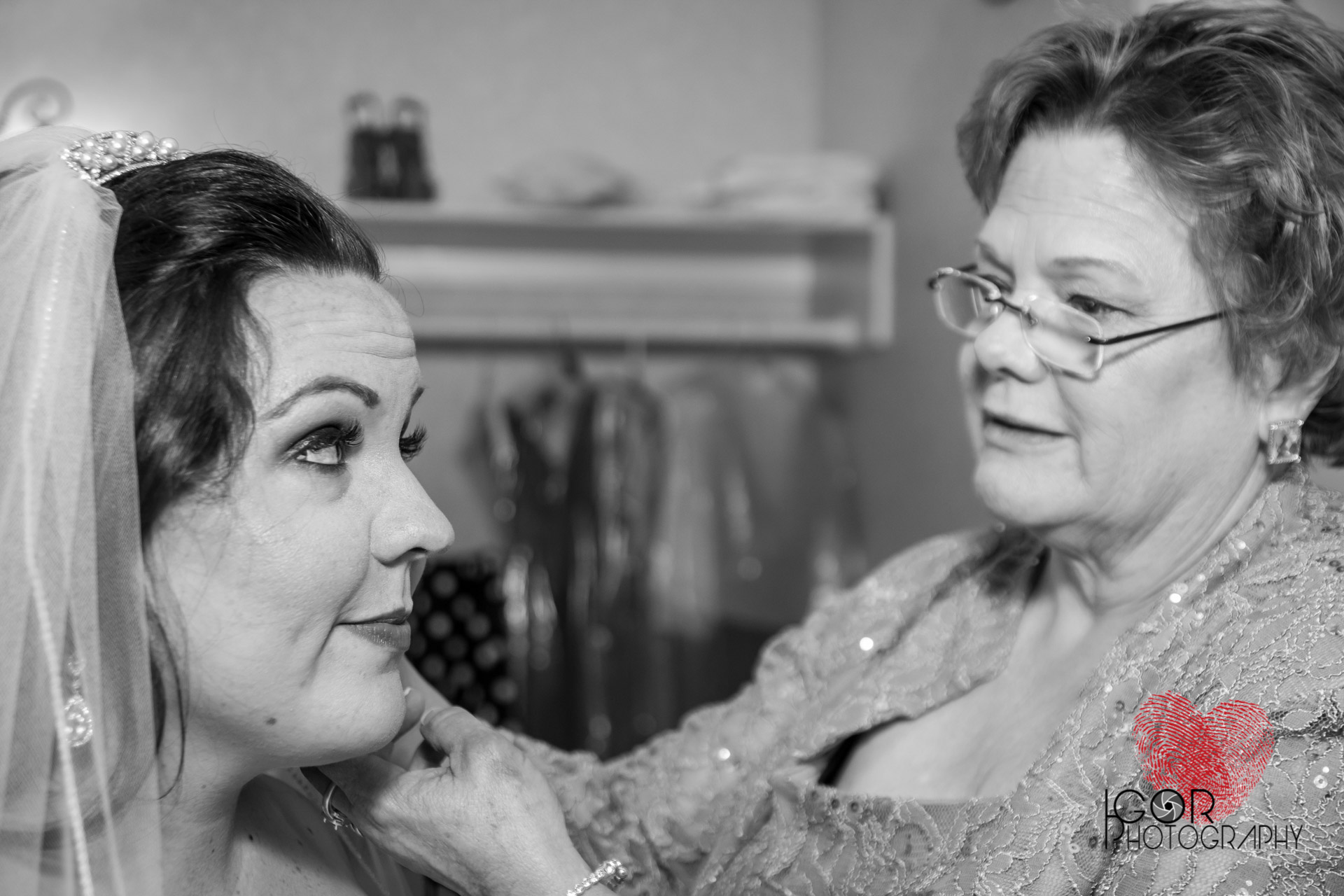 Bride getting ready with mother of the bride